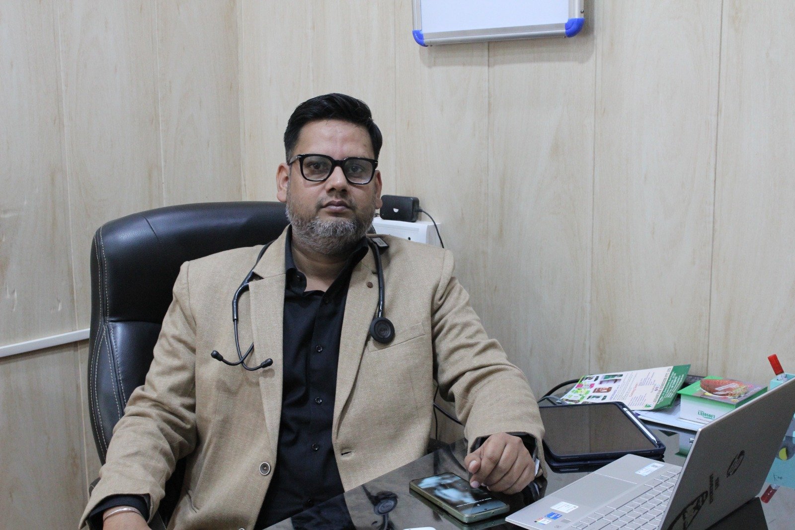 Homeopathic doctor seated in his consultation cabin at Samadhaan Homoeo Clinic, ready to provide personalized patient care